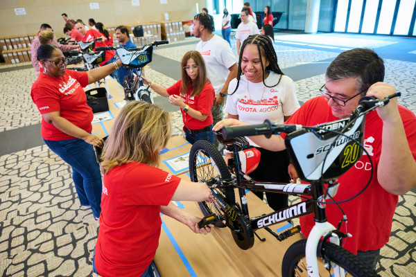 Team members are assembling bikes for the annual volunteer Bike Build event.