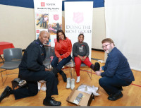 Envoy Artie Lewis TSA and Curt McAllister Toyota Deliver Boots and Socks to Families