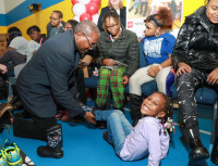 Toyotas Bill Shelmon Helps Families Try On New Winter Boots 2023